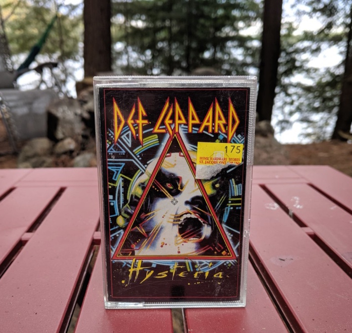 Def Leppard's Hysteria cassette in the forest