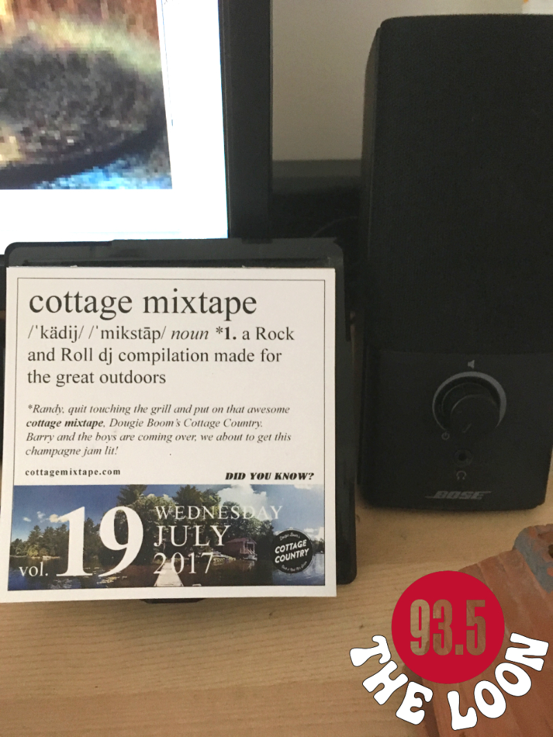 A tabletop calendar with the word phrase of the day, Cottage Mixtape: A Rock And Roll DJ mix for the great outdoors