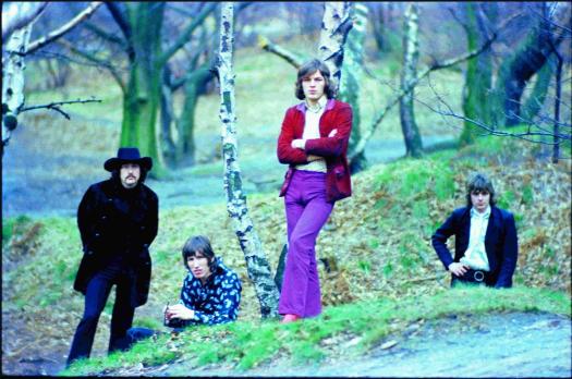 Pink Floyd with David Gilmour standing in a wooded area from the 1960's