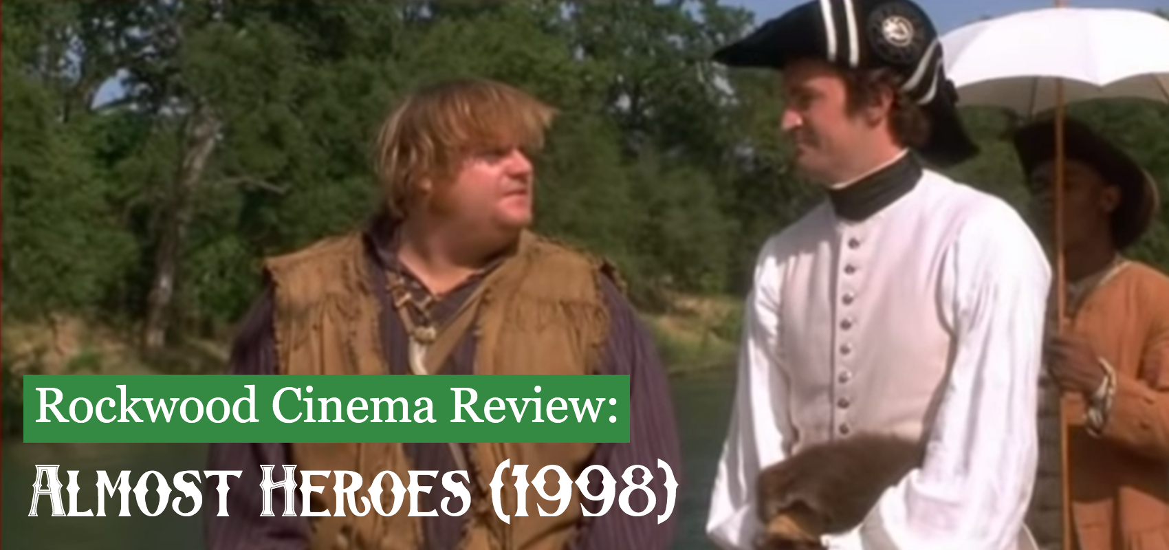A dishevelled Chris Farley looks at Matthew Perry wearing a colonial hat and white puffy armed shirt in the woods.